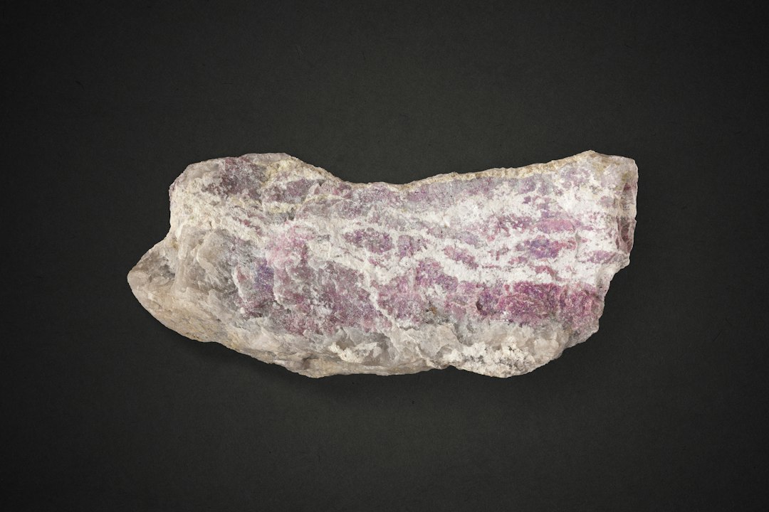 Lilac-pink lepidolite mineral specimen showing its layered mica structure